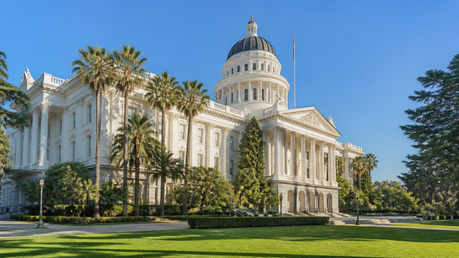California State Capitol dome and Capitol Park palm trees in Sacramento, civic landmark inside the 50-mile security guard vendor service radius